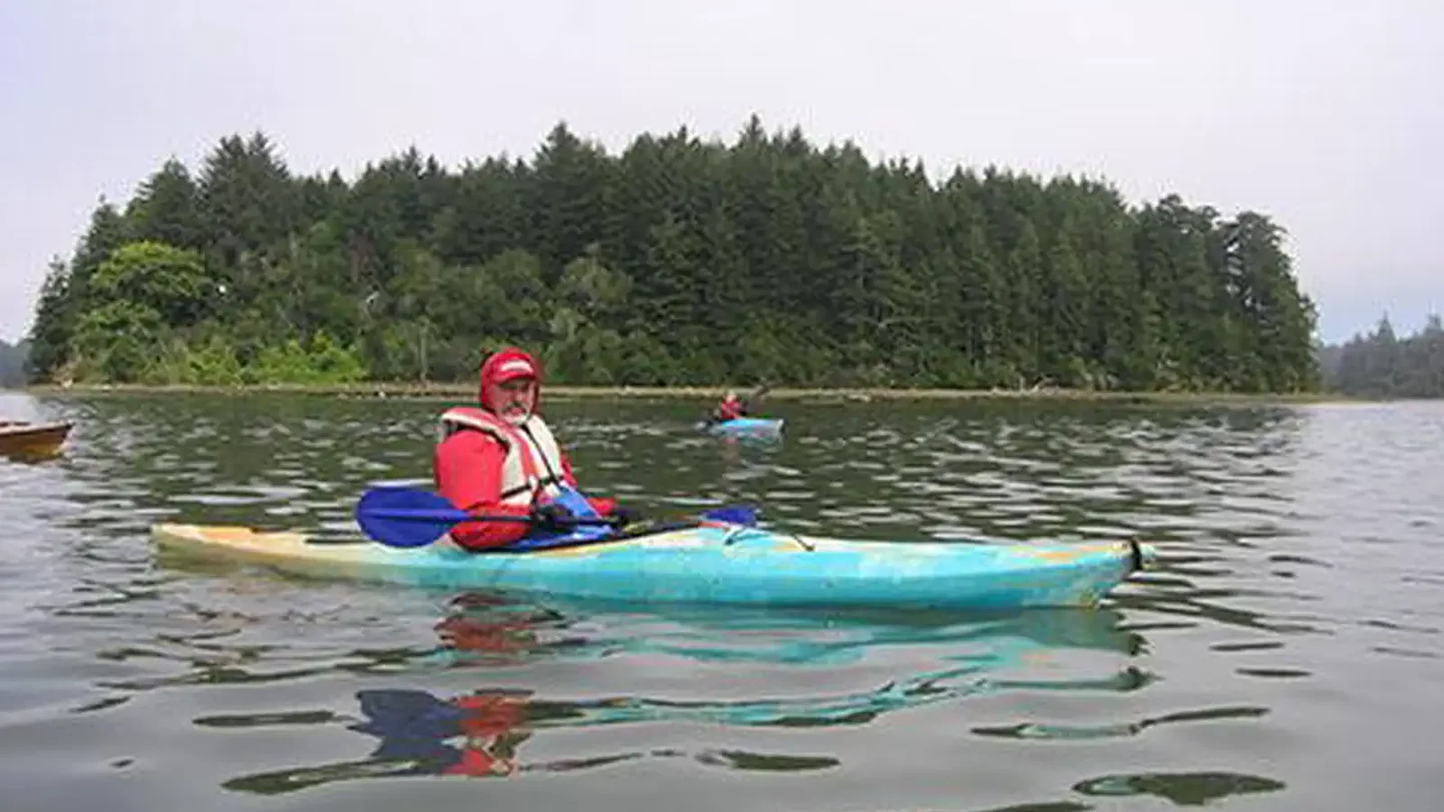 Kayaker paddling in South Slough National Estuarine Research Reserve, Oregon