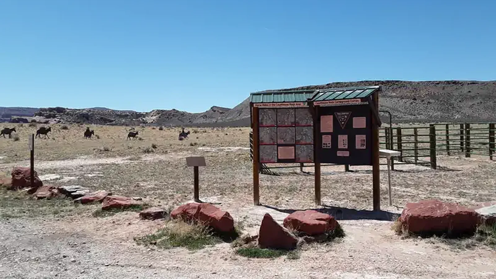 Courthouse Rock equestrian facilities with silhouette pack string in the background