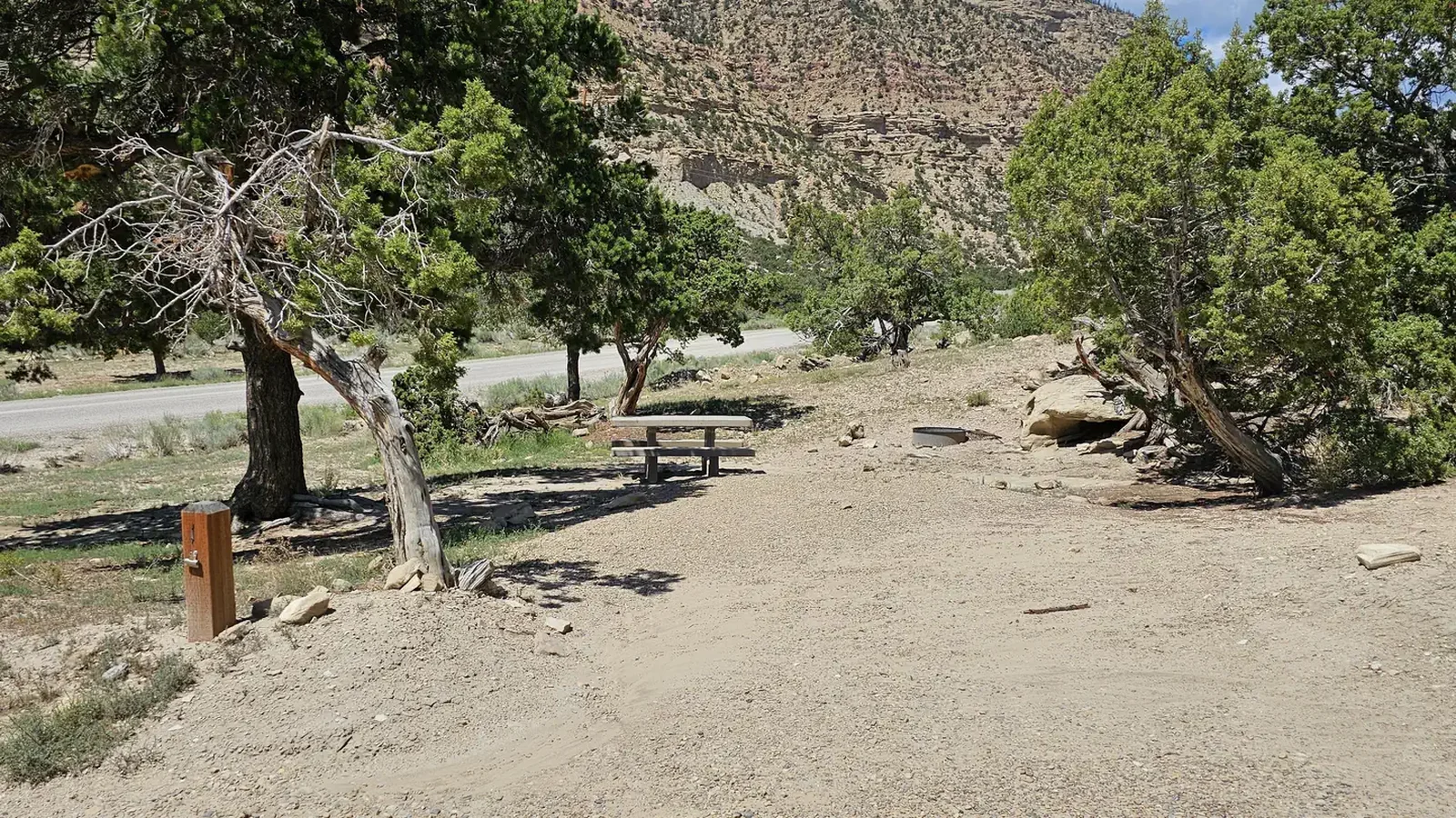 Cottonwood site. Campsite with picnic table and campsite post marker.