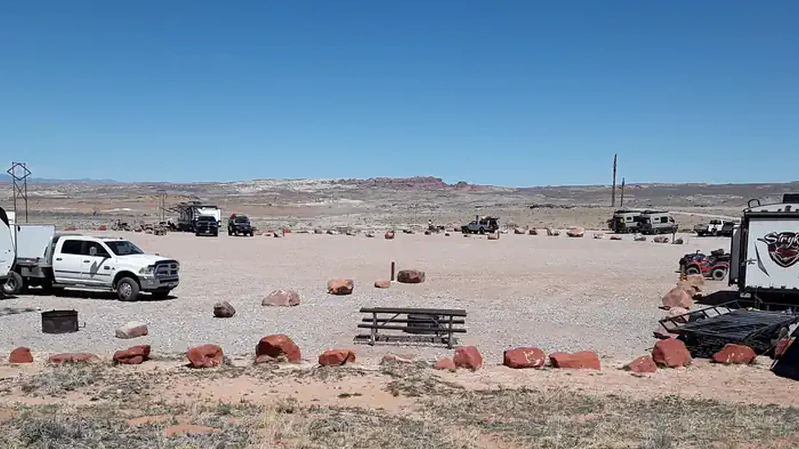 Courthouse Rock Campground campsites with Arches National Park in the distance