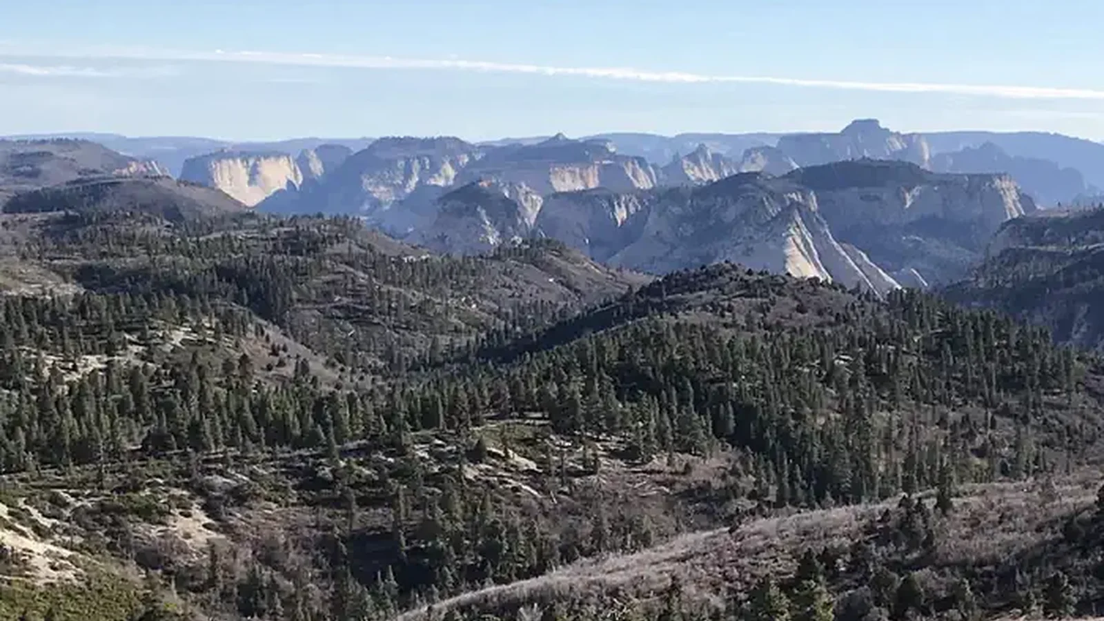 A panoramic view from Lava Point Lookout showing peaks and mesas.