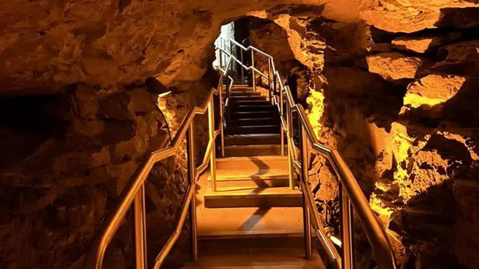 Stair case leading out of the cave through a narrow passageway