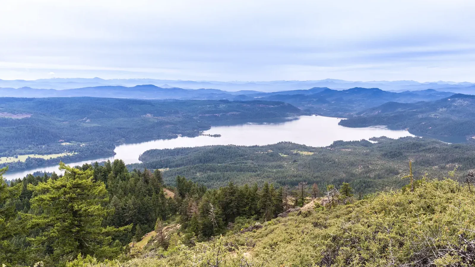 Aerial of Lost Creek Lake with cloudy