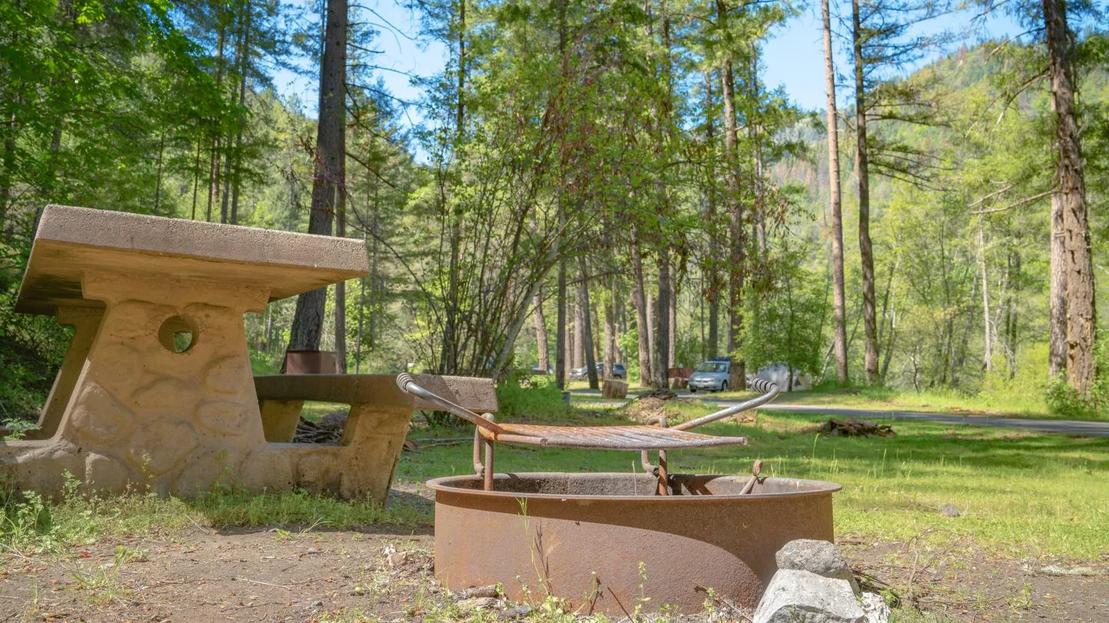 Close up of fire ring and picnic table at a camp site