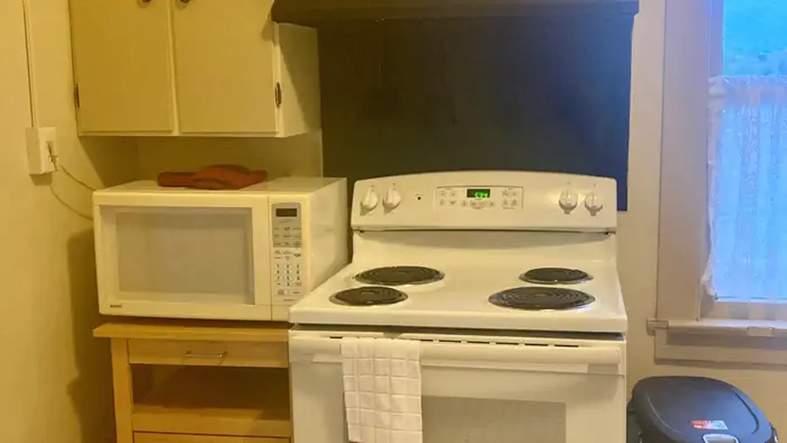 Kitchen with stove and microwave