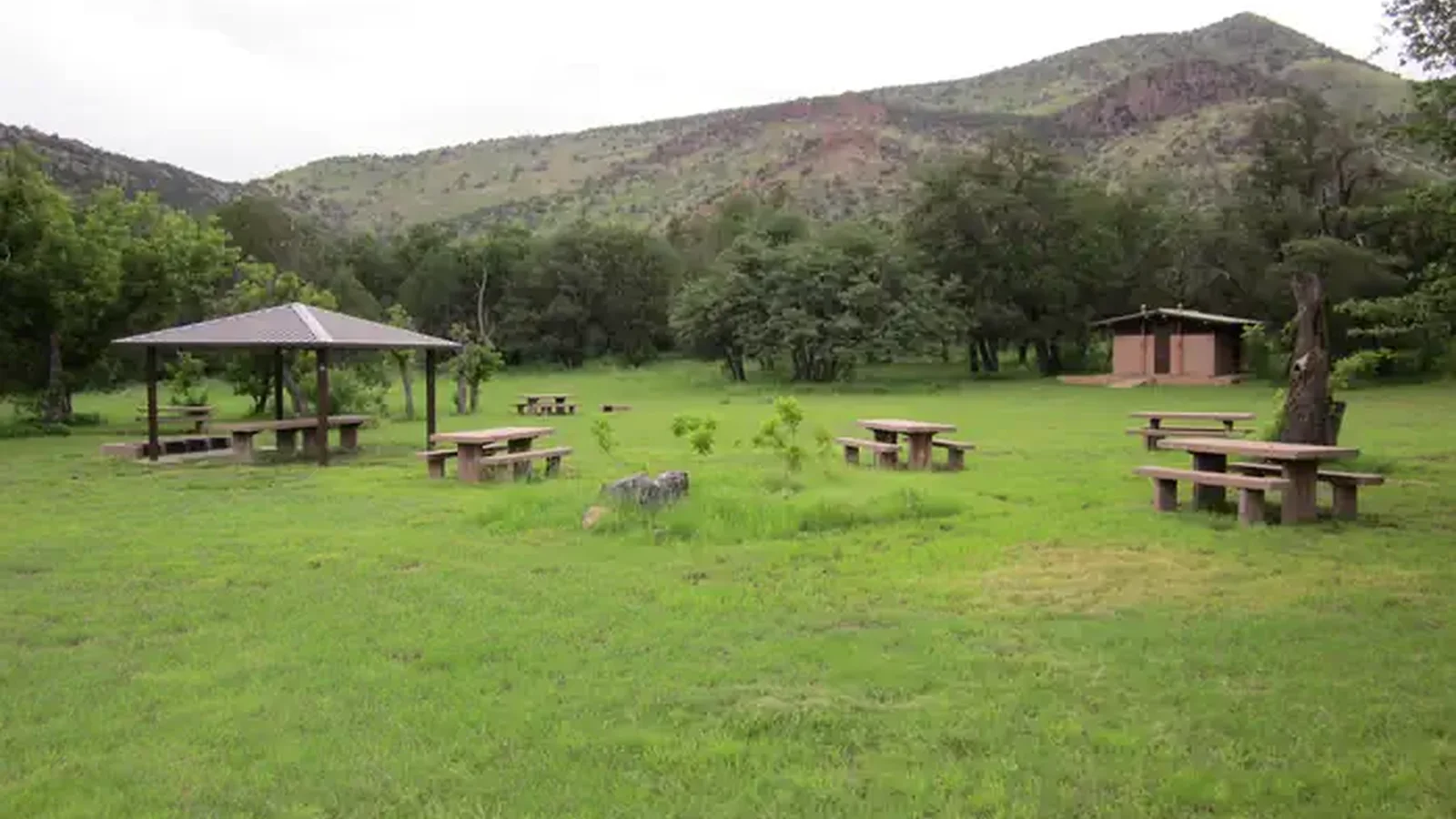 Picnic area with 4 tables and bathroom