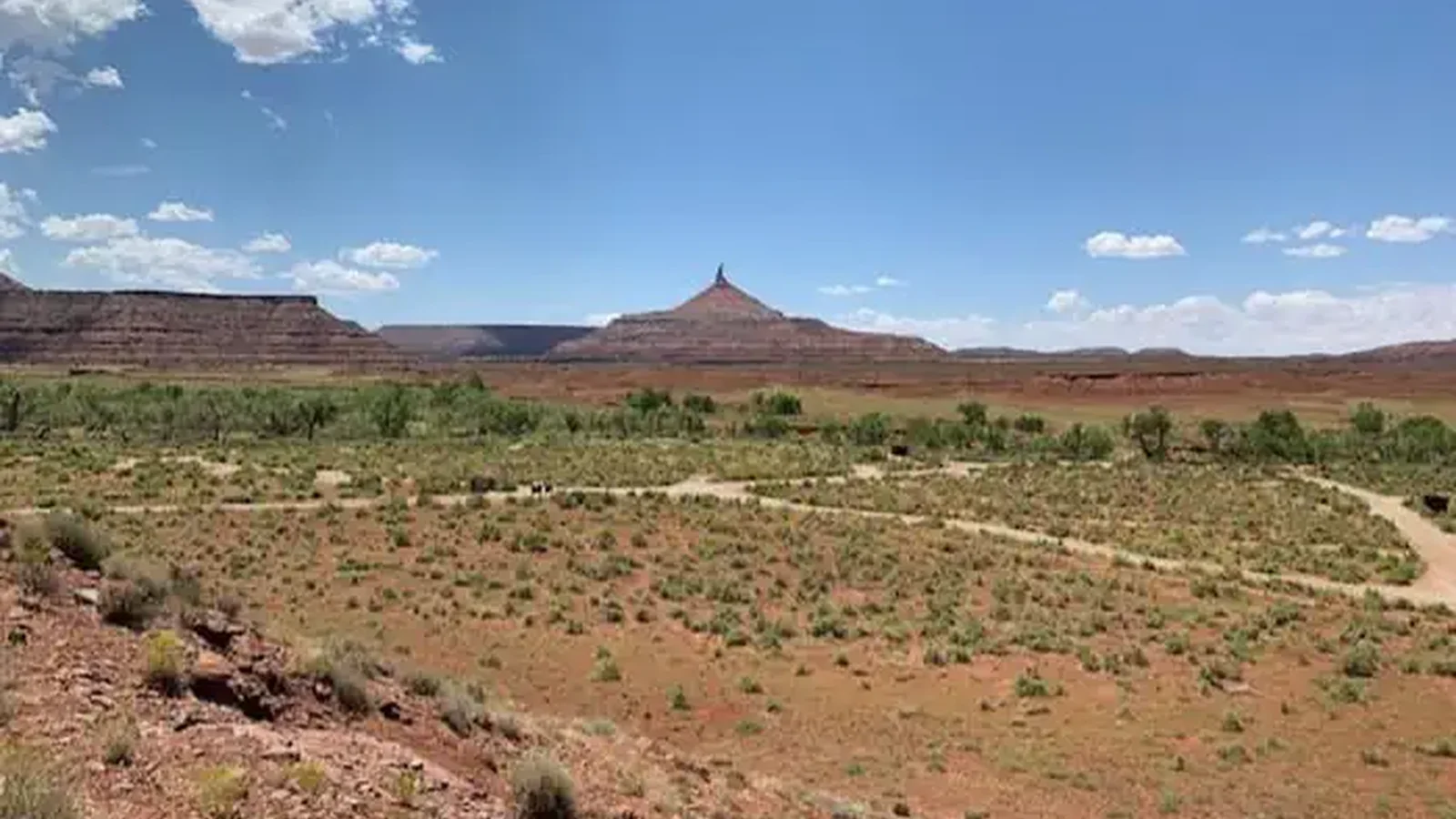 view of the desert campground with a ribbon of cottonwood trees