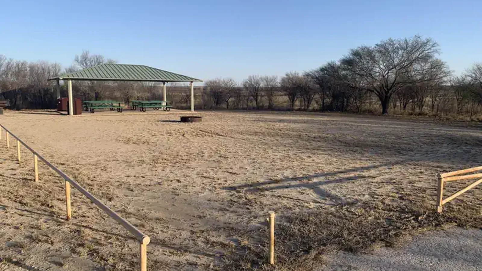The group picnic shelter and fire pit area