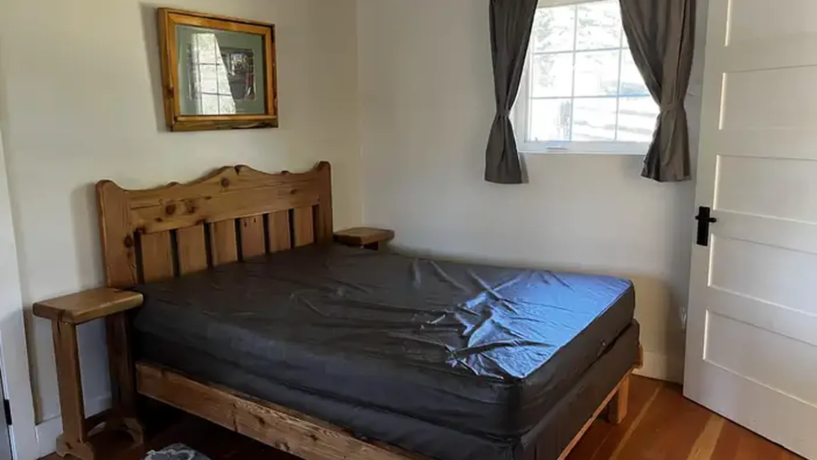 Double bed with nightstands on either side.