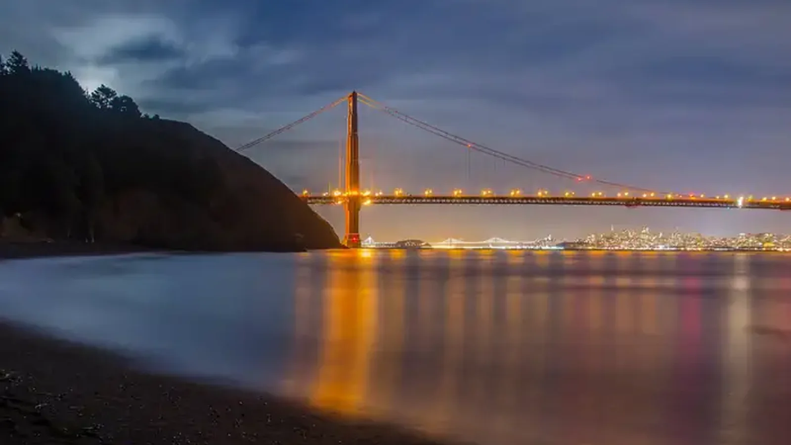 A view of the bay from Kirby Cove, with the Golden Gate Bridge lit.