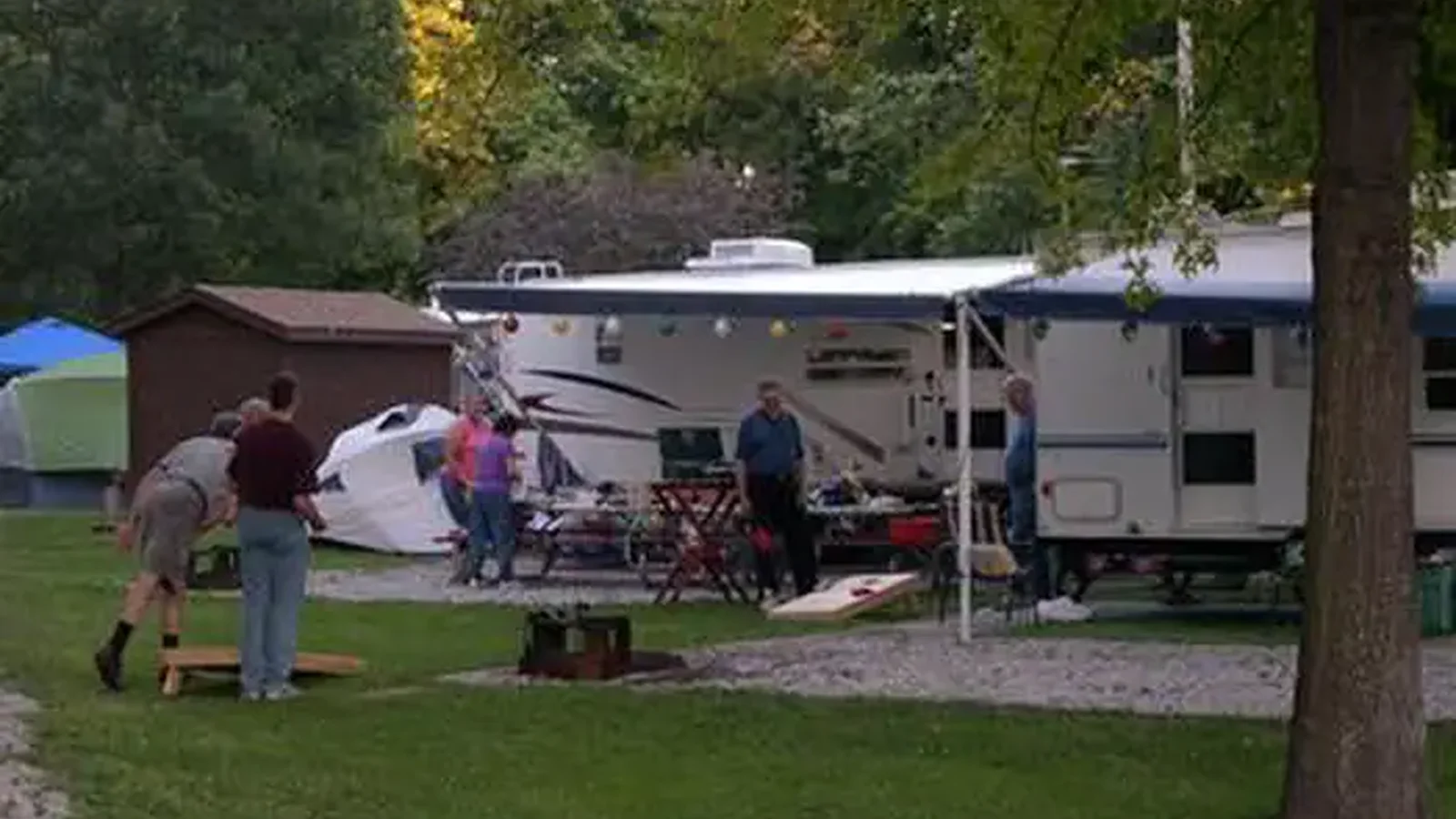 People playing game at their campsite.