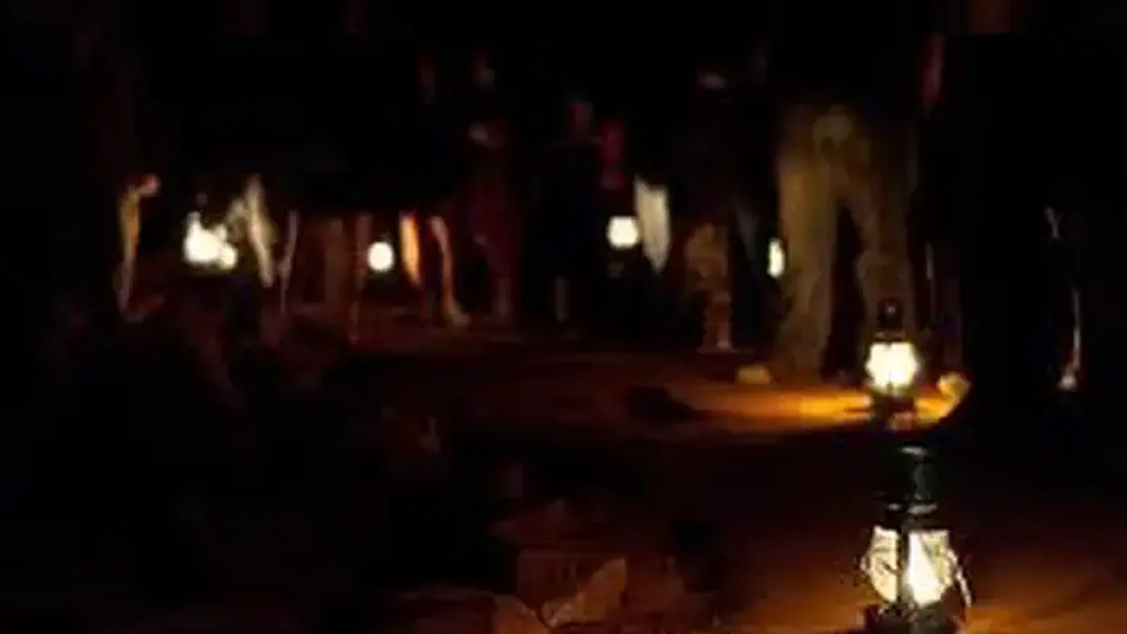 Visitors carrying lanterns on the Violet City Lantern Tour